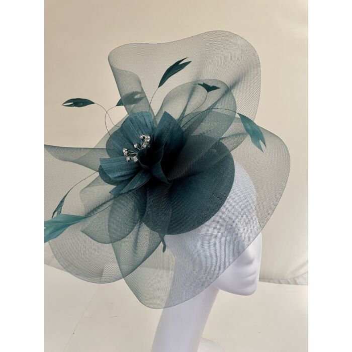 Deep green fascinator with visor and swirls with flower and feathers