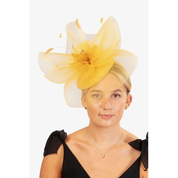 Mustard fascinator with visor and swirls with flower and feathers