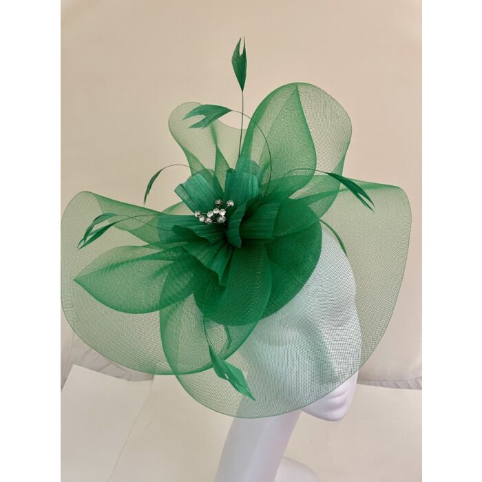 Shamrock green fascinator with visor and swirls with flower and feathers