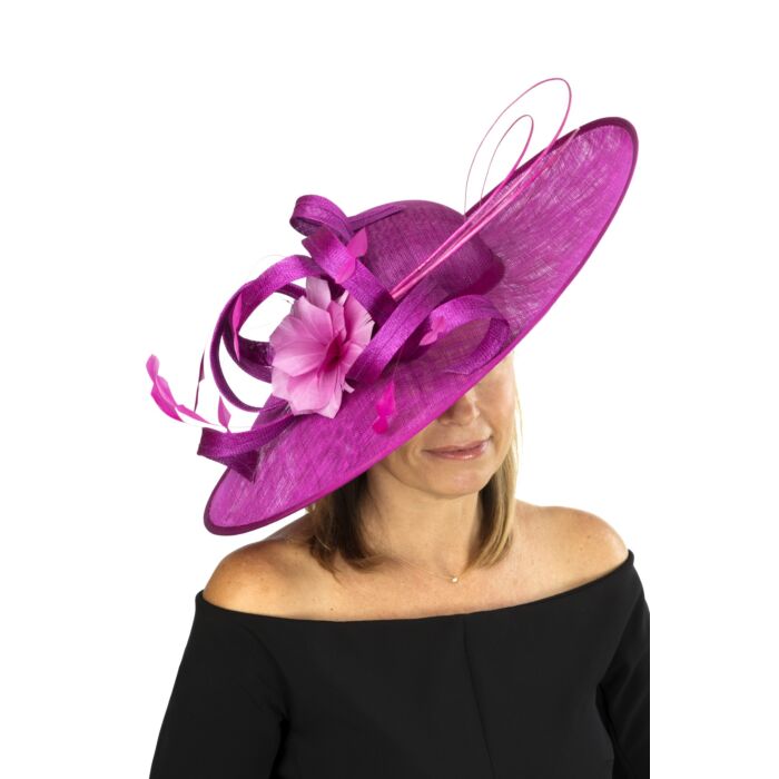 Magenta fascinator with sinamay loops, feather flower and quills
