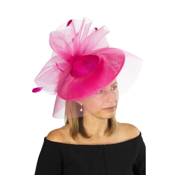 Cherry coloured fascinator with crin swirls and visor and fine feathers
