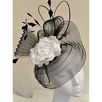 Black and white fascinator, with a soft rose fine feathers and quills