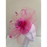 Candy fascinator with visor and swirls with flower and feathers