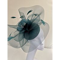 Deep green fascinator with visor and swirls with flower and feathers