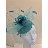 Jade green fascinator with flower and feathers