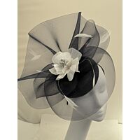 Navy and white pill box fascinator with flower and feathers