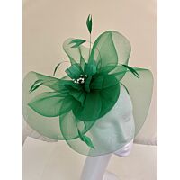 Shamrock green fascinator with visor and swirls with flower and feathers